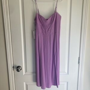 Sunday best- NWT Flowy purple dress with slit